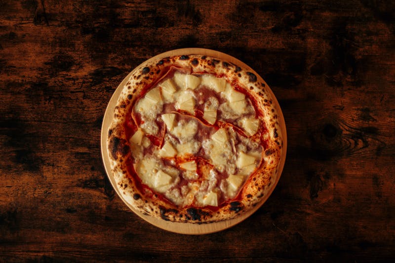 Hawaiian pizza with ham and pineapple